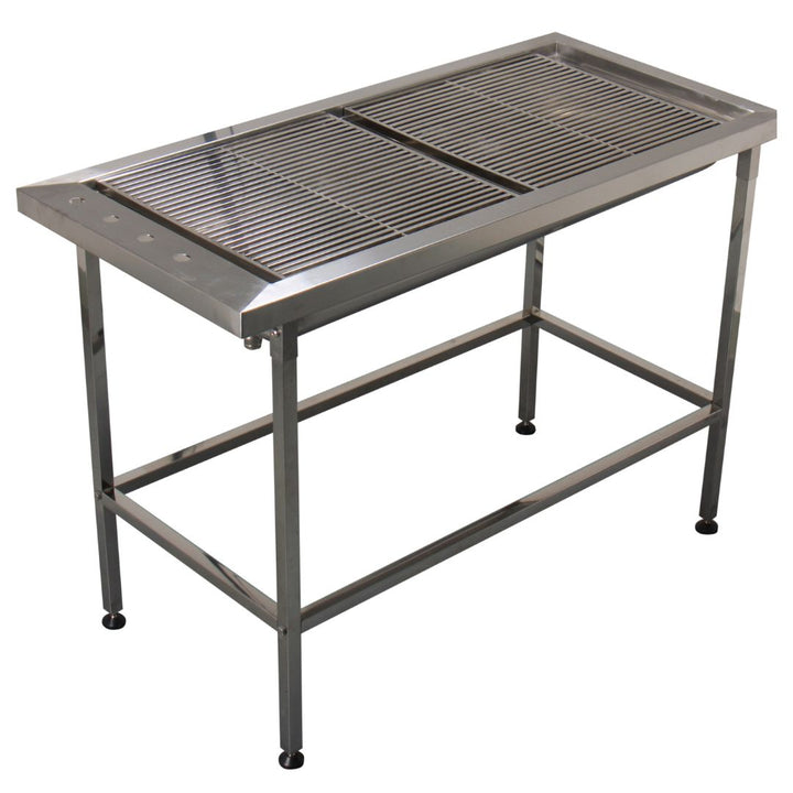 Multipurpose Stainless Steel Tub Table for Veterinary Use (ABK Grooming): A veterinarian performing a dental procedure on a pet securely positioned on the Aeolus TT-202 Tub Table from ABK Grooming. This stainless steel table features a flat work surface, integrated drainage system, and nonslip rubber legs for stability. Upgrade your veterinary clinic with a versatile table! Shop Now at ABK Grooming.